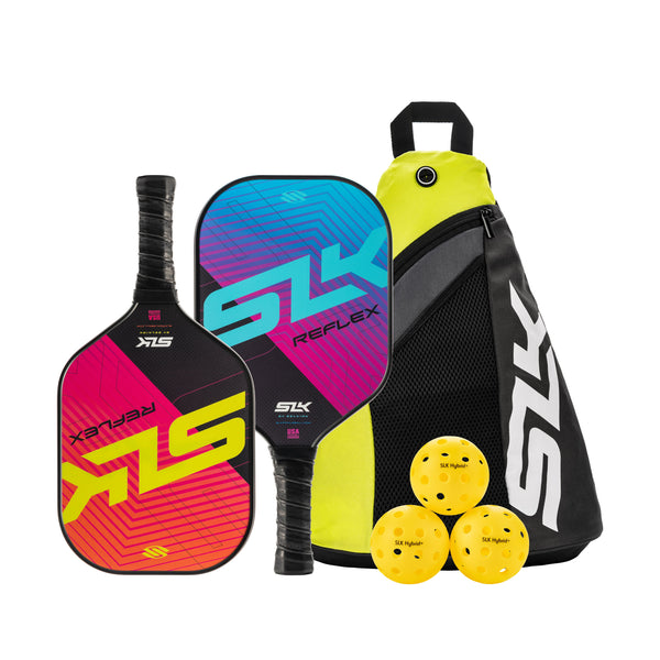 Two colorful SLK REFLEX pickleball paddles, SLK carry bag, and three yellow balls labeled SLK Hybrid.