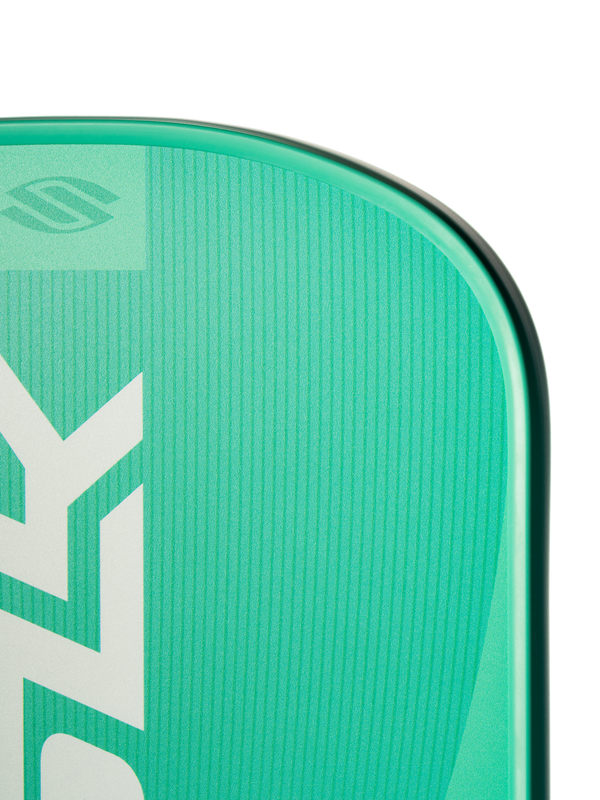 Teal-green board corner with vertical white 'ZY' logo and textured deck pad along a rounded rail.